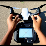 **Drone Videography Preparation:** A beginner drone videographer preparing to fly a drone, reviewing a checklist including budget considerations, video goals (cinematic quality), license and registration requirements (CAAB in Bangladesh), drone settings, and camera optimization (resolution, frame rate, ISO).